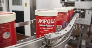 umpqua ice cream carton on a conveyor belt