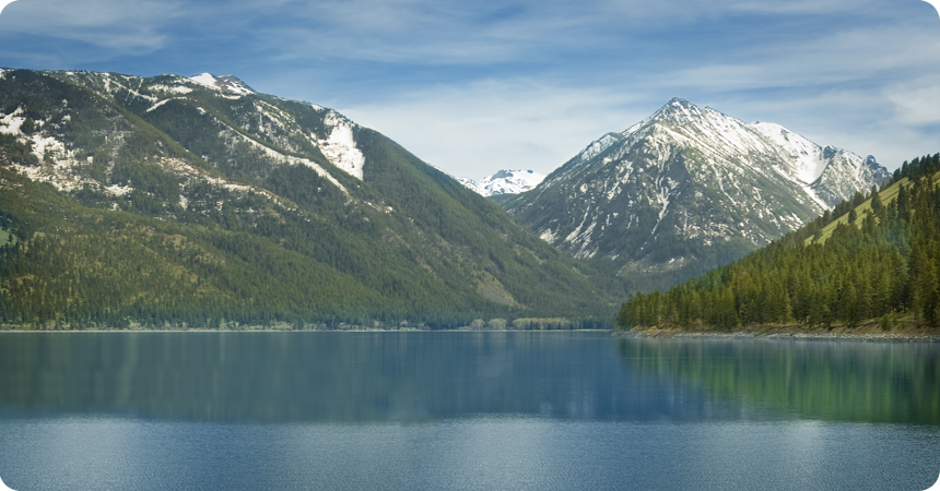 Scenic view of Wallowa Lake and the mountains in the background.