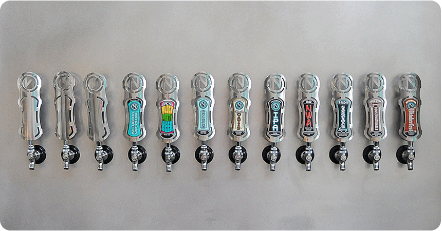 a collection of ninkasi tap handles