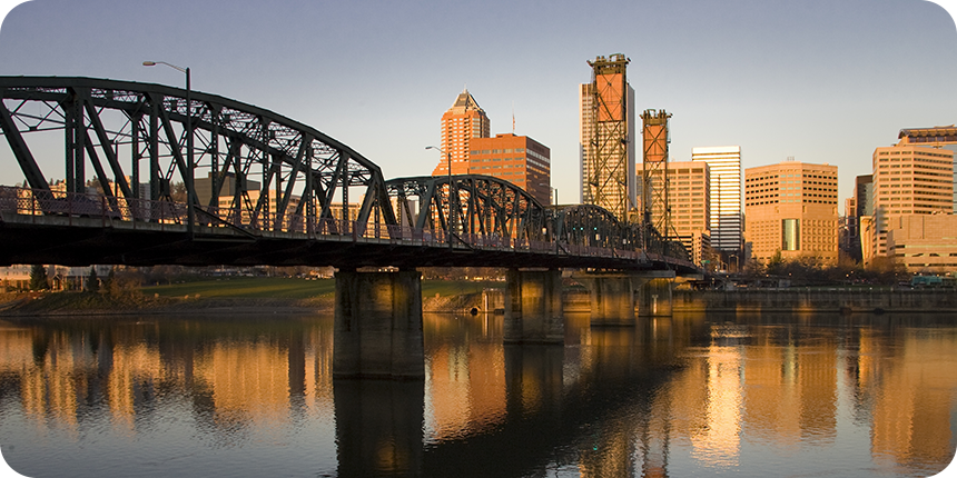 a view of downtown portland during sunrise