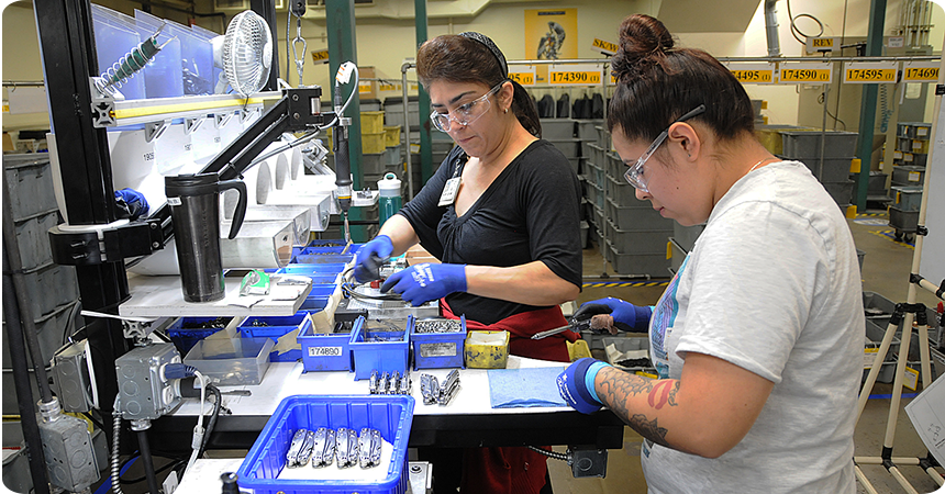 two women working on leatherman tools