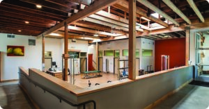 a work out facility with a skylight letting in natural light