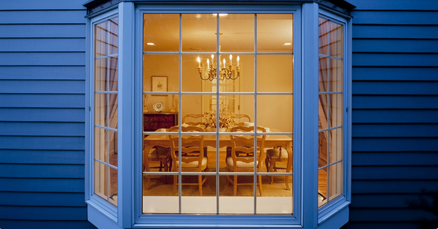 well lit dining room with an electric chandelier