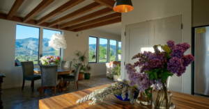 a beautiful home interior with a vase of flowers on a wooden table