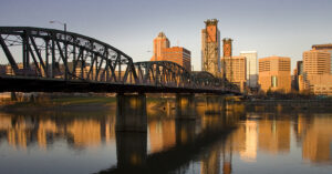 a view of the Hawthorne Bridge in Portland at sunset