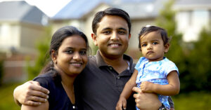 Varatharajan family in front of their home