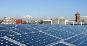 solar panels in front of a Portland skyline