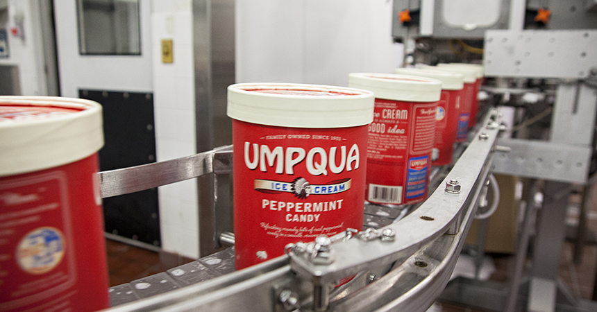 umpqua ice cream carton on a conveyor belt