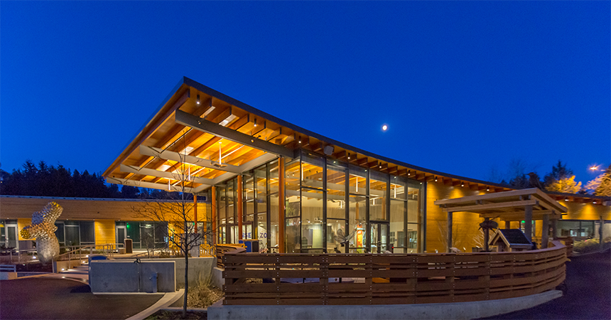 Exterior view of the education center at the Oregon zoo at dusk