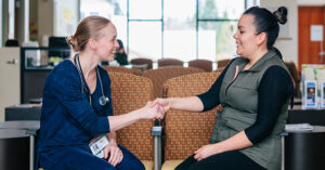 patient shaking hands with her doctor in the Wellness Center