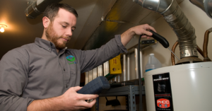 GreenSavers technician performing a test on a water heater