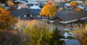 aerial view of a school with fall foliage