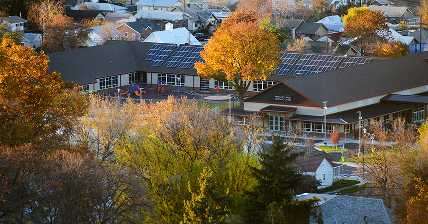 aerial view of a school with fall foliage