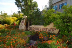 Deschutes Brewery sign with flowers