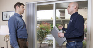 an energy trust representative helping a apartment owner