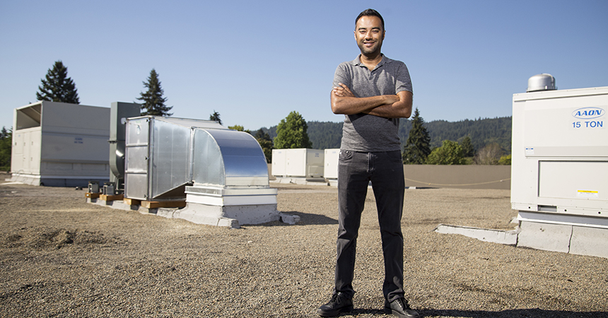 Ankur Rungta, CEO of Cloud Cover Cannabis, stands among rooftop HVAC units installed to maximize the efficiency of the firm's indoor cannabis growing facility.