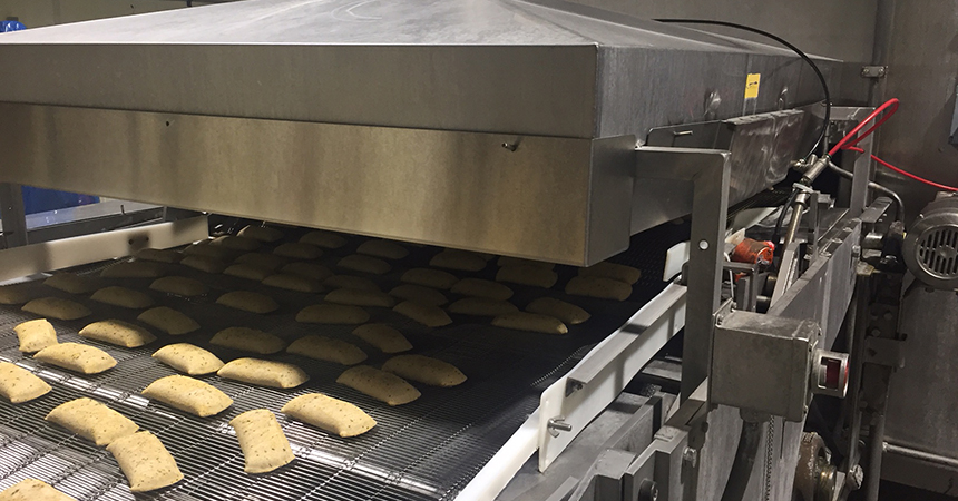 frozen pocket sandwiches on a conveyor belt