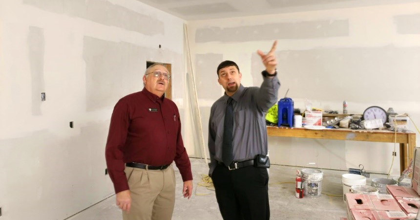 Mike Cleveland and Tyler Phelps check out progress of construction for EOCI’s new wellness and training center for employees. 