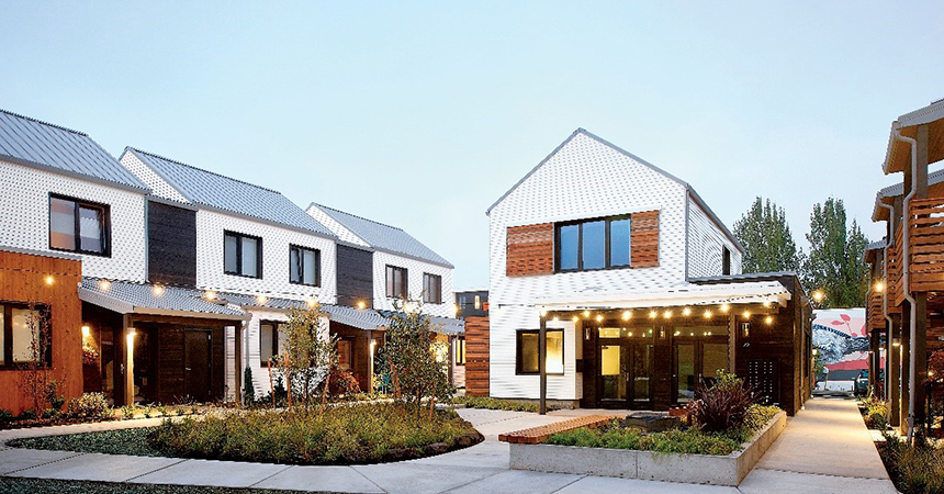 nicely manicured lawns in front of newly built homes