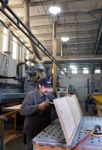 A man working with tools in a warehouse