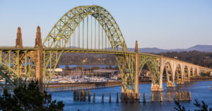 a bridge in newport oregon at sunset