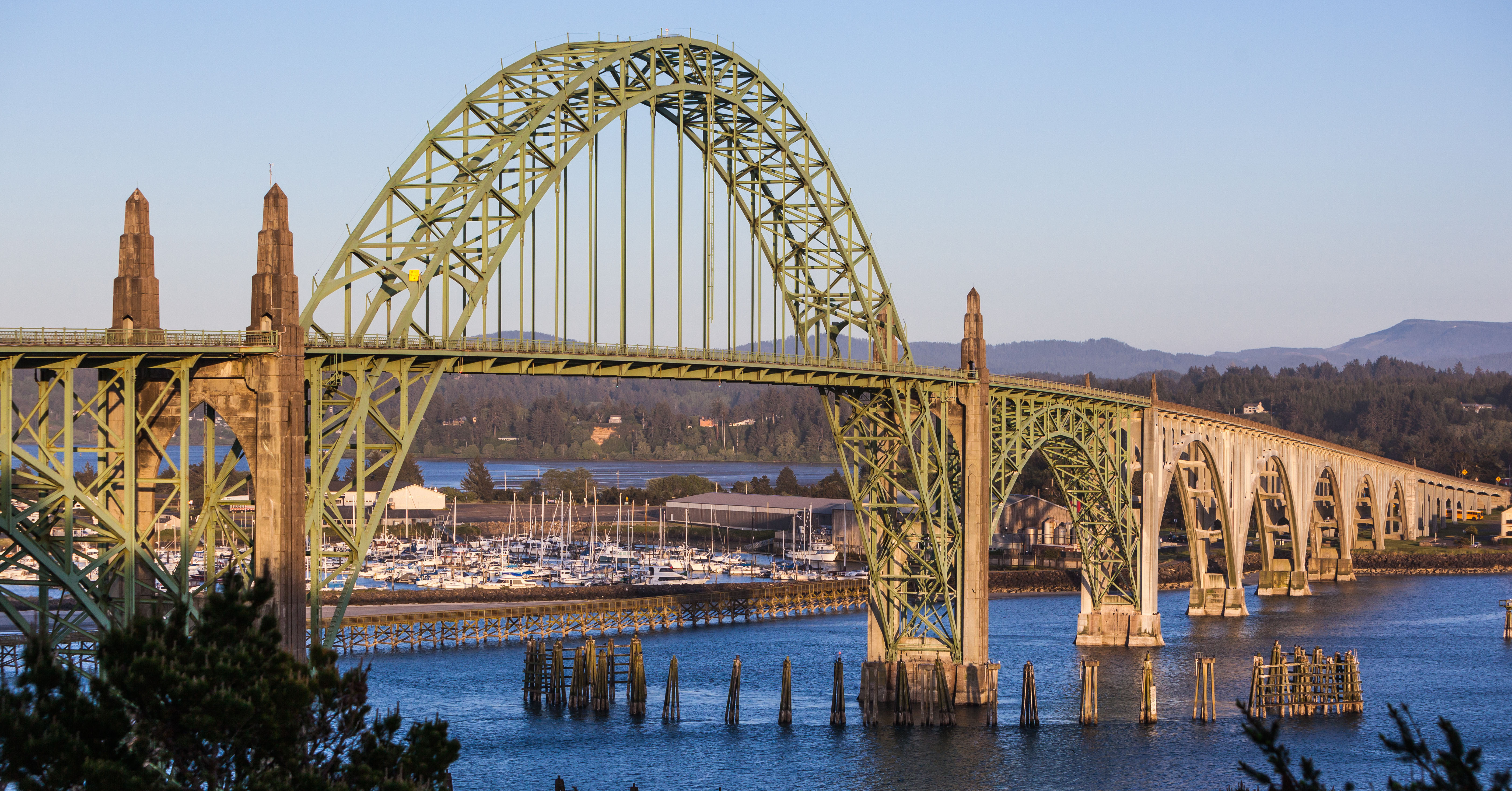 a bridge in newport oregon at sunset