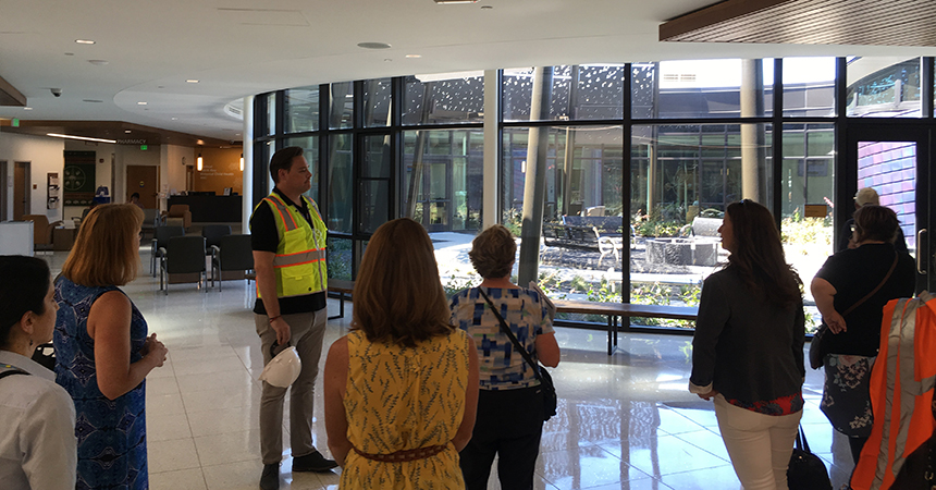 a group of people touring yellowhawk facility