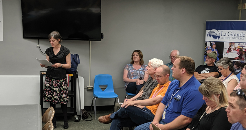 Energy Trust’s Eastern Oregon outreach manager, Caryn Appler, shared La Grande School District’s energy-efficiency report card with community members during a school board meeting in June.