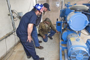 Men inspecting machinery