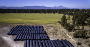 irrigation pipes with mountains in the background