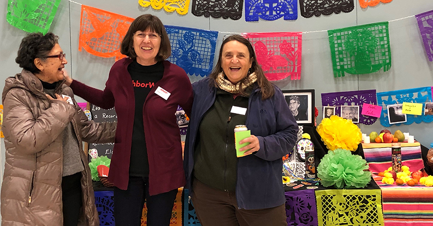 energy trust outreach staff at a day of the dead event
