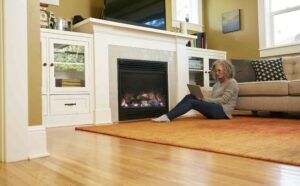woman in front of fireplace