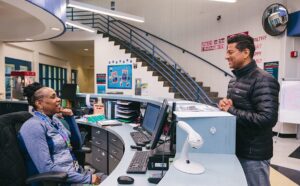 person chatting with receptionist