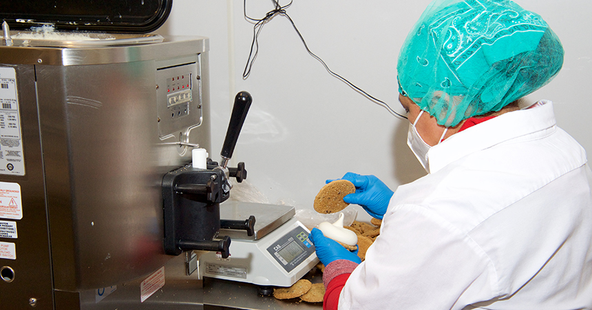 a worker making ice cream sandwiches