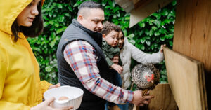 Family at a chicken coop