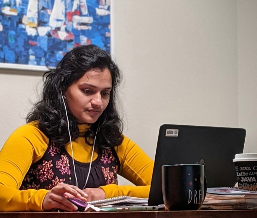 A person sitting at their computer