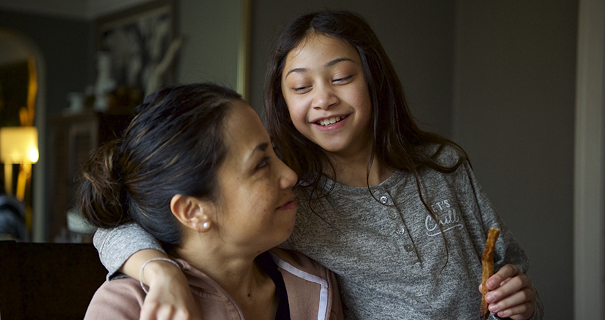 daughter hugging mother