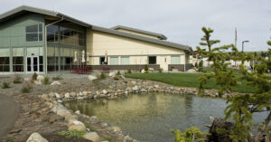 Exterior of hospital with pond