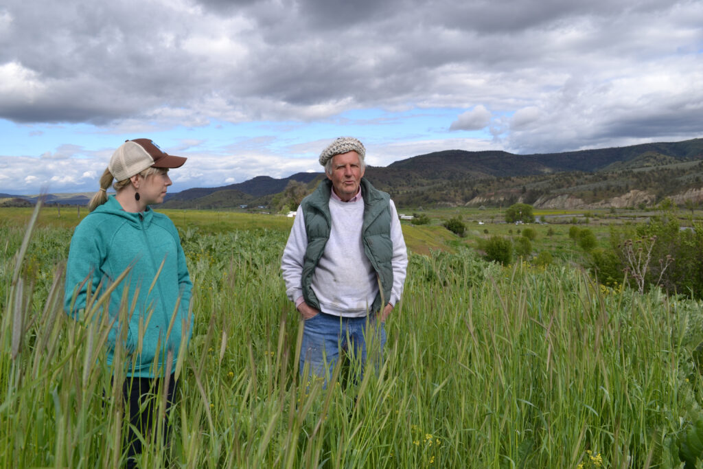 Man and woman standing in a field