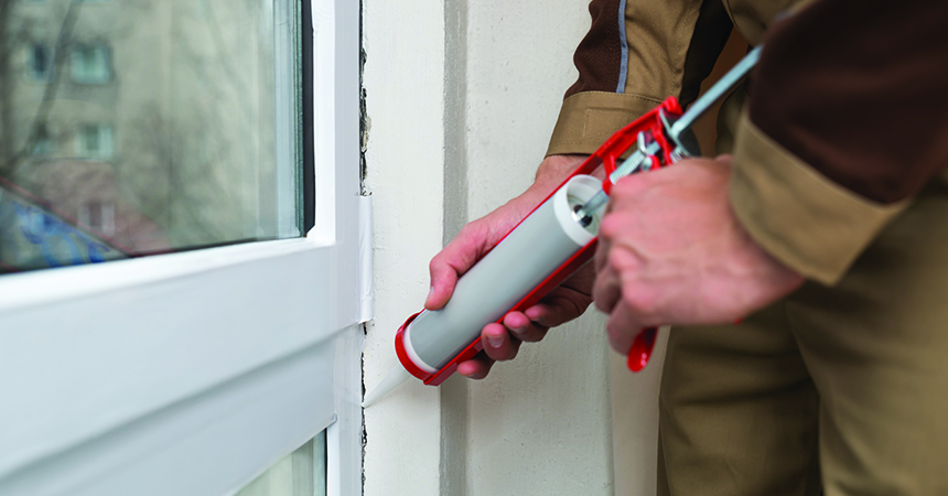 Person Applying Silicone Sealant Weatherization