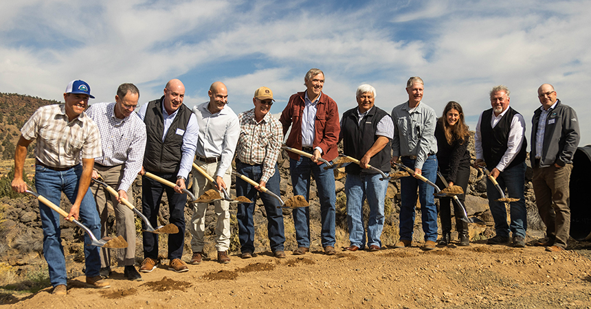 Group of people holding shovels