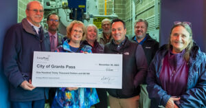 group holding large check to City of Grants Pass