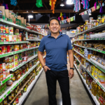 Man standing in a market aisle