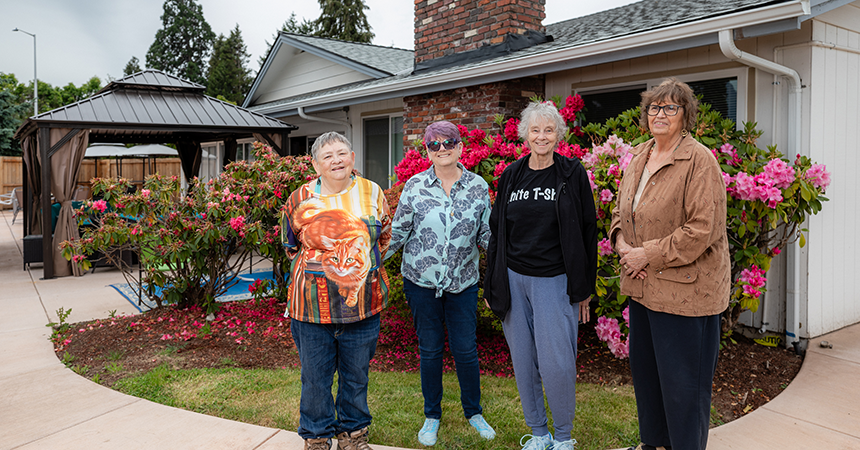 Filbert Grove Cooperative residents outside the community club house.
