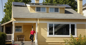 Marsie Martien stands outside her home, where a rooftop solar system helps power a more sustainable and energy-efficient future.